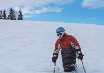 A photo of a person skiing in the snowy mountains.