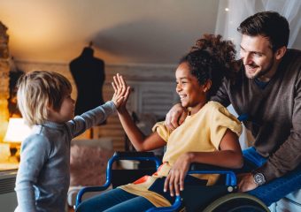 Family with wheelchair user at home