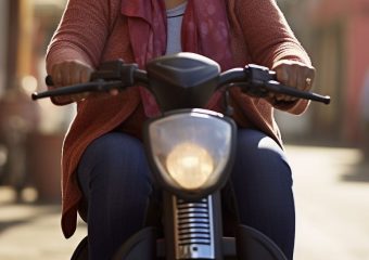 Woman riding mobility scooter, header image